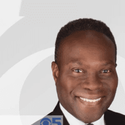 Smiling man in suit, KPIX news logo.